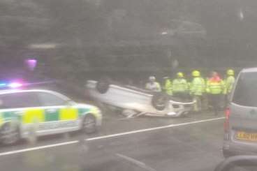 Emergency services were called to a the car on its roof on the M20. Picture: @ReeveSTARRR