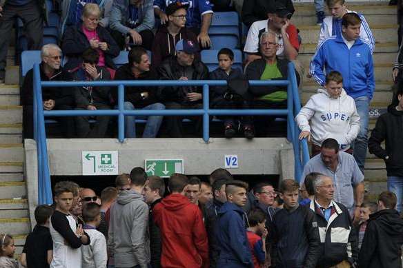 Home fans leave early during the closing stages of Gillingham's game against Bradford on Saturday. Picture: Barry Goodwin