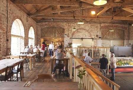 Much of the interior brickwork and exposed roof beams have been left at the restaurant and farmers' market. Picture: JIM BELL