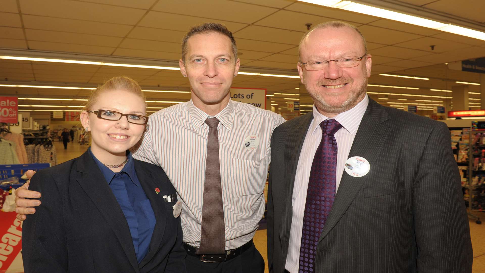 Grant (centre), pictured with manager Gerry Byrne and Jade Pollitt, was dared to have the procedure after a making a "foolhardy error" in the work canteen. Picture: Steve Crispe.