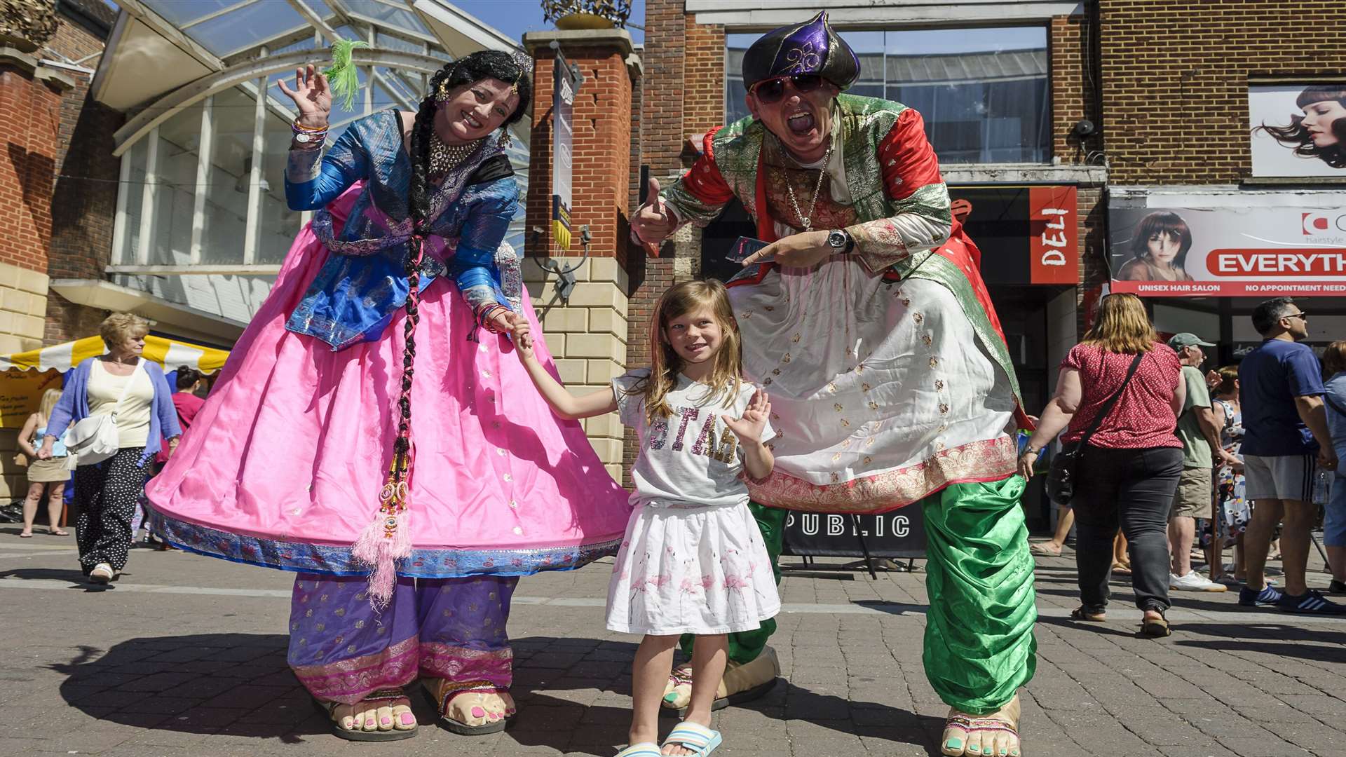 NutKhut stilt walkers meet Maddison Benfield, six. Picture: Andy Payton