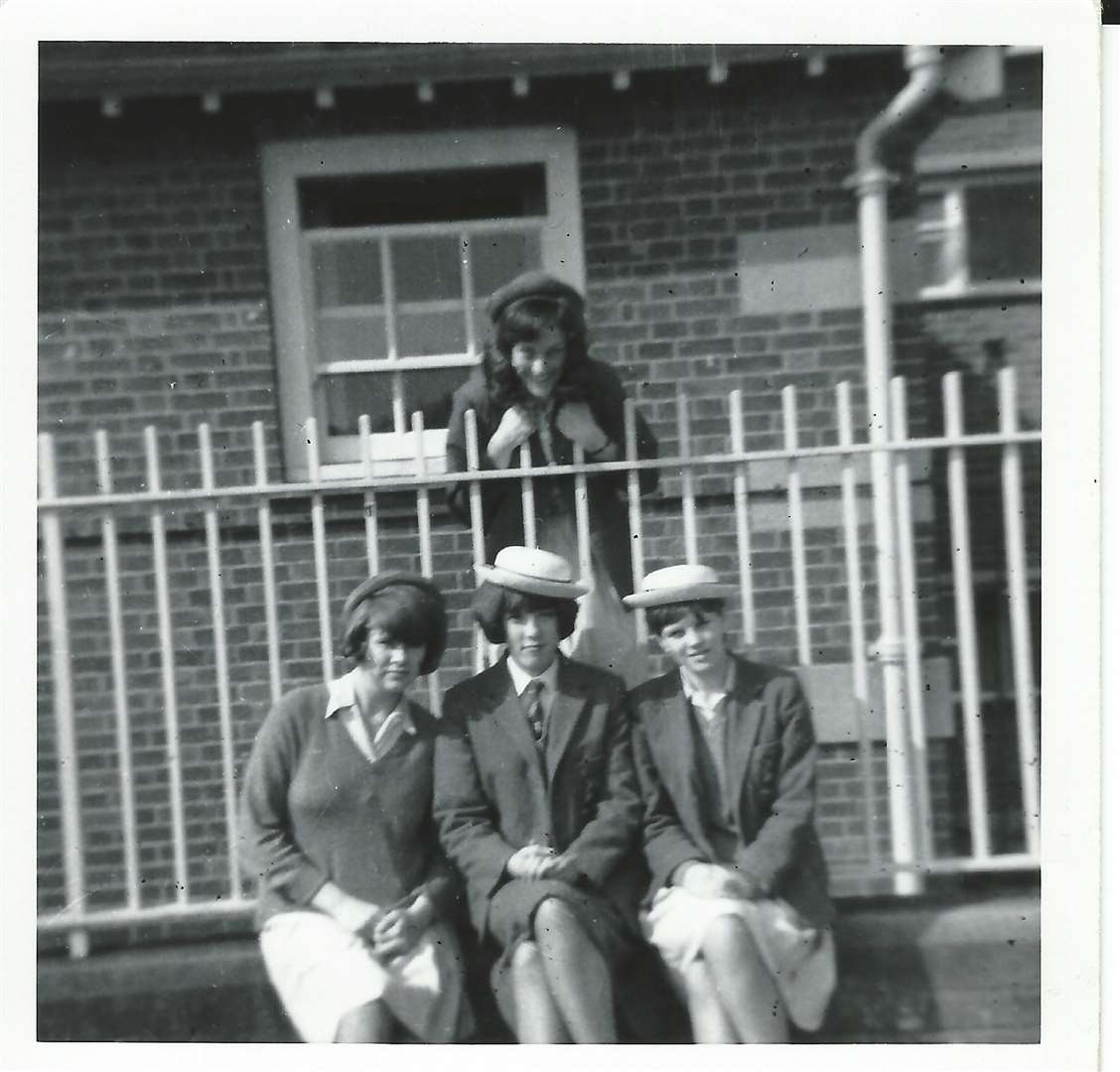 Back - Helen Reid. Front, left to right, Jane Turk, Jean Riley, Lois.Dyer outside the school changing rooms in 1964. Two are wearing the "awful" winter grey felt hats, two with summer boaters