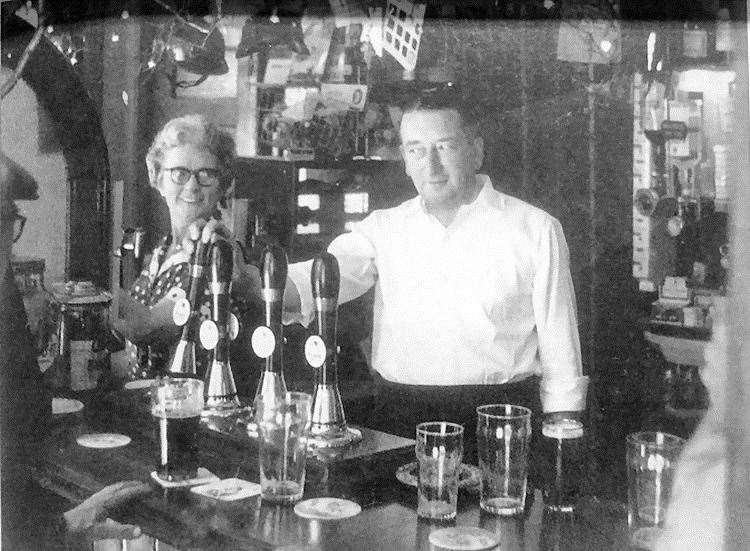 Lilian and Ron Crisp behind the bar of the Bell & Crown pub in Canterbury in 1957. Picture Rory Kehoe