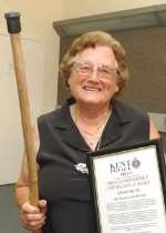AWARD: Daphne Chandler with her certificate of merit and trusty walking stick. Picture: MIKE WATERMAN