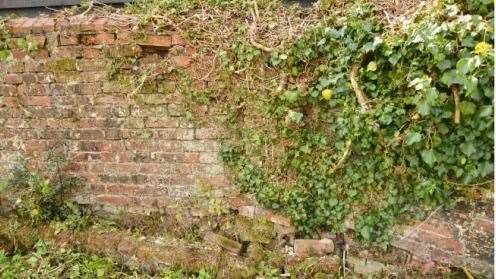 Neighbours in Hollingbourne don't want an old wall to be knocked down, claiming it will impact the heritage asset of their home