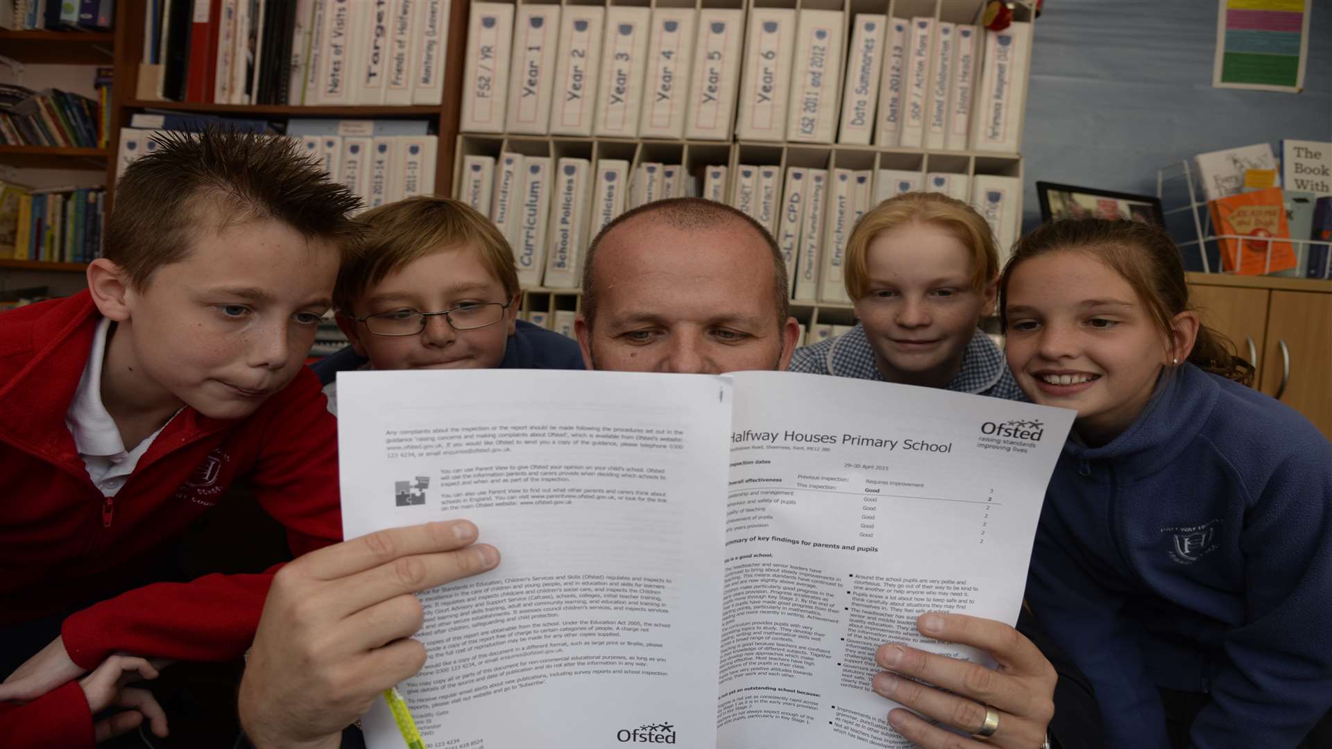 Head Ryan Driver and pupils Harvey, Dylan, Olivia and Amy, all 11 read the Ofsted report at Halfway Houses Primary School
