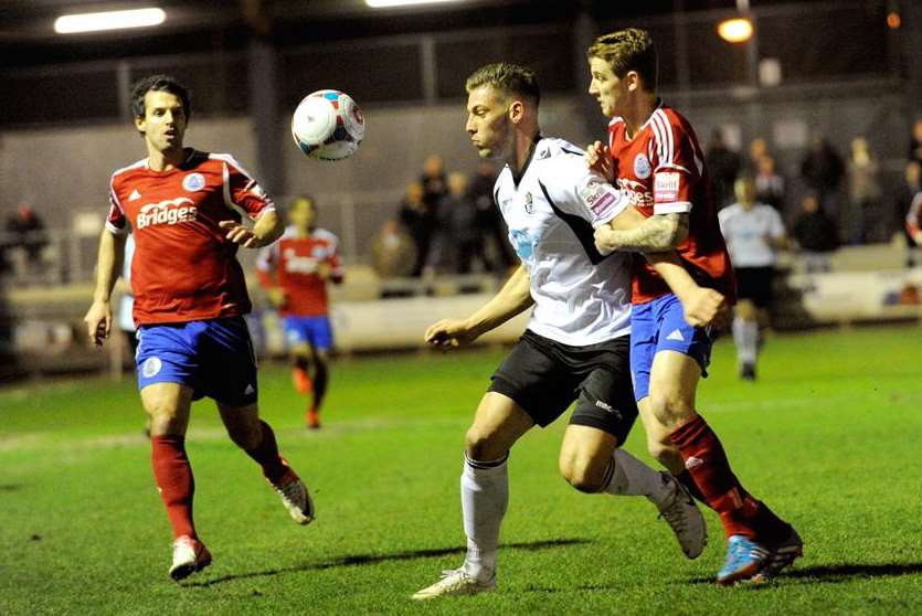 Alex Wall takes on two Aldershot defenders Picture: Simon Hildrew