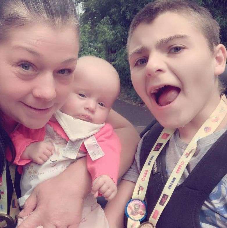 Sonny with his baby sister Lola and mum Keely at Chessington