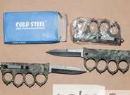 Knuckledusters and knives siezed from Simon Abbott's home. Picture: Kent Police