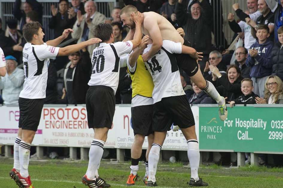 A shirtless Matt Godden celebrates the late goal which won the game for Dartford and completed his hat-trick (Pic: Andy Payton)