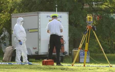 Police officers searching for clues at the scene. Picture: GRANT FALVEY