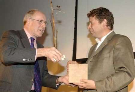 Collin Hills (right) receives the award from Cllr Roger Manning. Picture: PAUL DENNIS