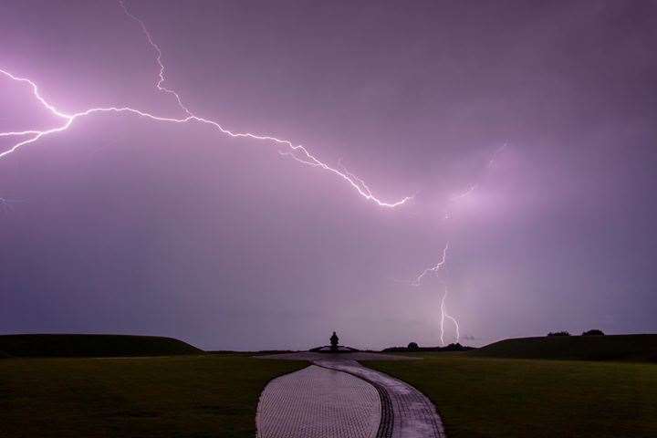 Lightning strikes at the National Memorial to the Few at Capel-le-Ferne on Tuesday. Picture: Greg Esson