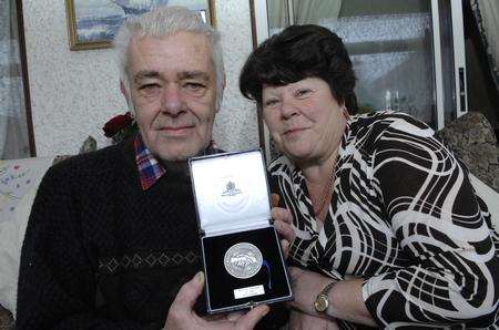 Chris and Maria Hammond of Selsea Avenue, Herne Bay with the medal awarded postumously to his uncle George.