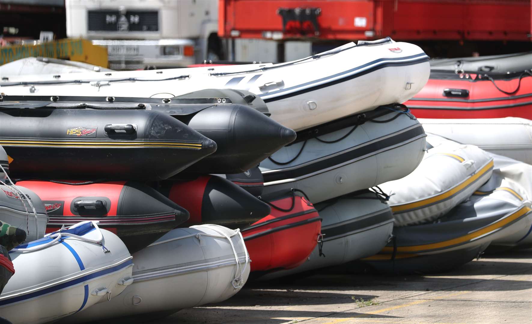 Boats in a secure compound in Dover which have been seized after being intercepted in the Channel while carrying migrants from the French coast to England