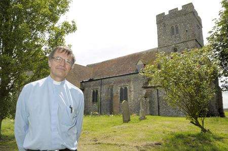 Rev Steve Lillicrap outside St Mary's Church, Teynham, where thieves stolen lead from the roof twice in just one weekend