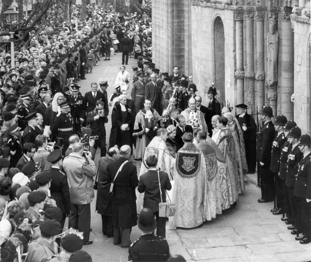 Huge crowds turned out to welcome the Queen and Prince Philip to Rochester for the Maundy service in the cathedral in March 1961. The couple walked from the Guildhall along the high street to the cathedral for the distribution of the Maundy money. The Queen is seen here with the Mayor of Rochester, Cllr I J Phillips