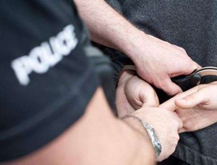 A police officer making an arrest - stock image