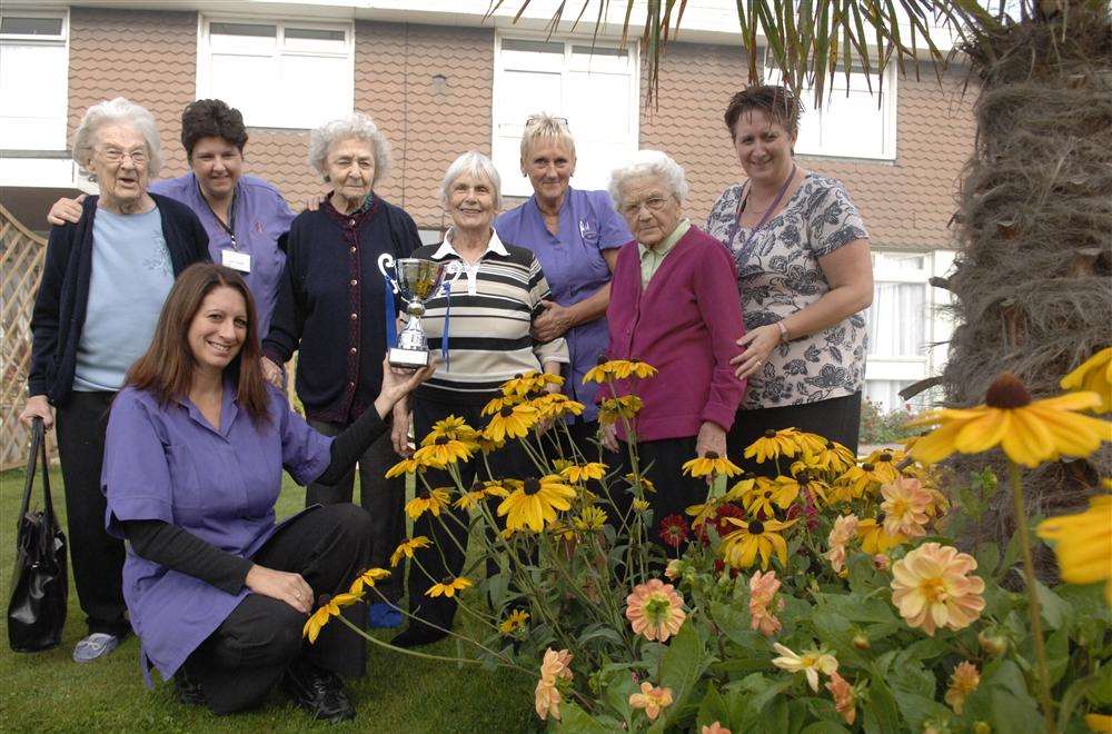 Residents and staff at Barton Court in New Road, Minster admire their award-winning gardens