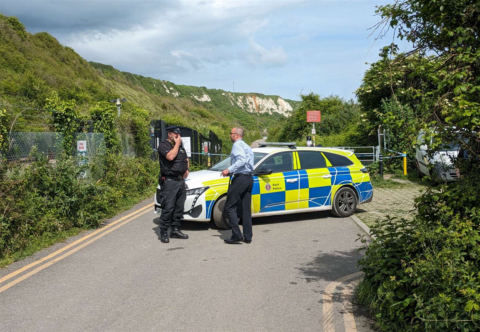 Police taped off The Warren, where the body of a woman was found in undergrowth this afternoon