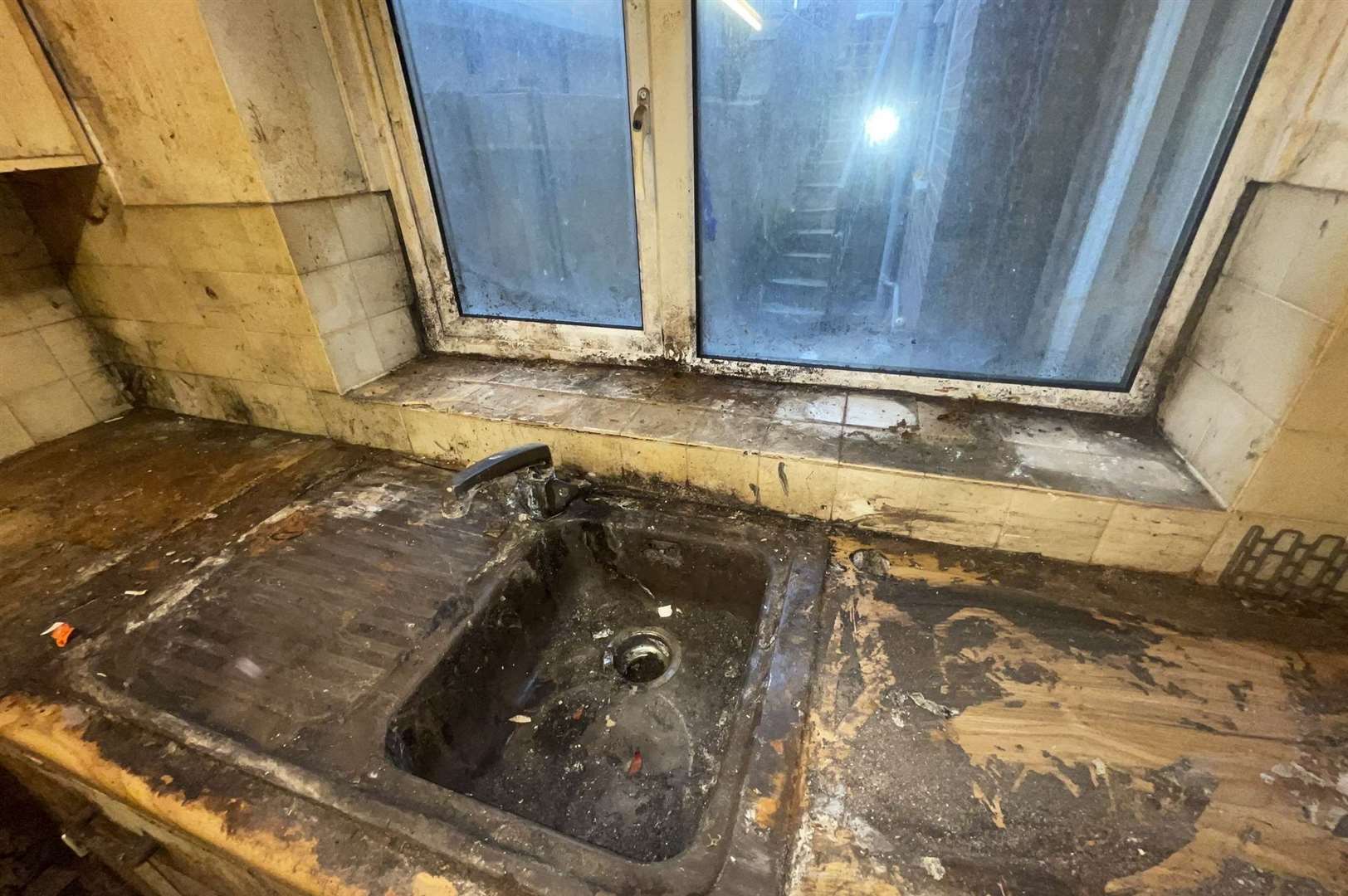 Filthy kitchen inside a property that hadn’t been cleaned properly in twenty years. Photo: SWNS
