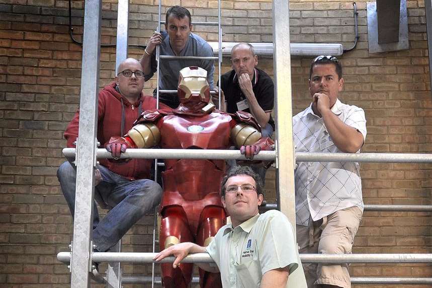Barry Southee dressed as Iron Man with BayPromoTeam's Scott Turner, Dave Hammond (on ladder), Dave Ware, Gerald McCarthy, and, front, David Aldridge, of Herne Bay Mobility