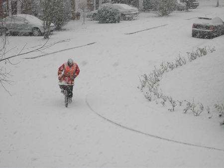 Intrepid postie in Winchester Gardens, Canterbury. Sent in by Roger Thornington