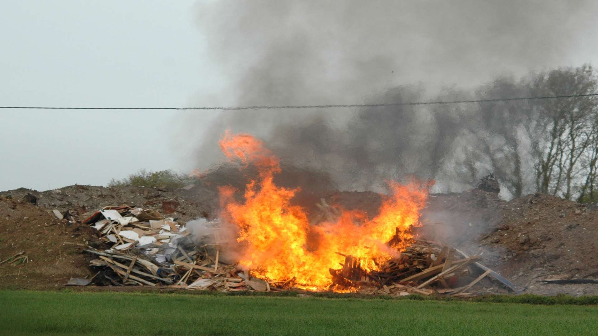 Photographs taken by environmental officers investigating illegal waste dumping at Marlow Farm near Lenham