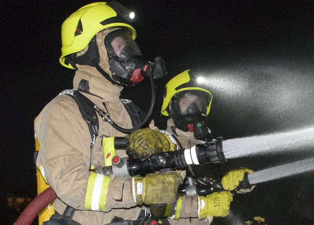 Firefighters in full breathing apparatus fought the flames (stock picture)
