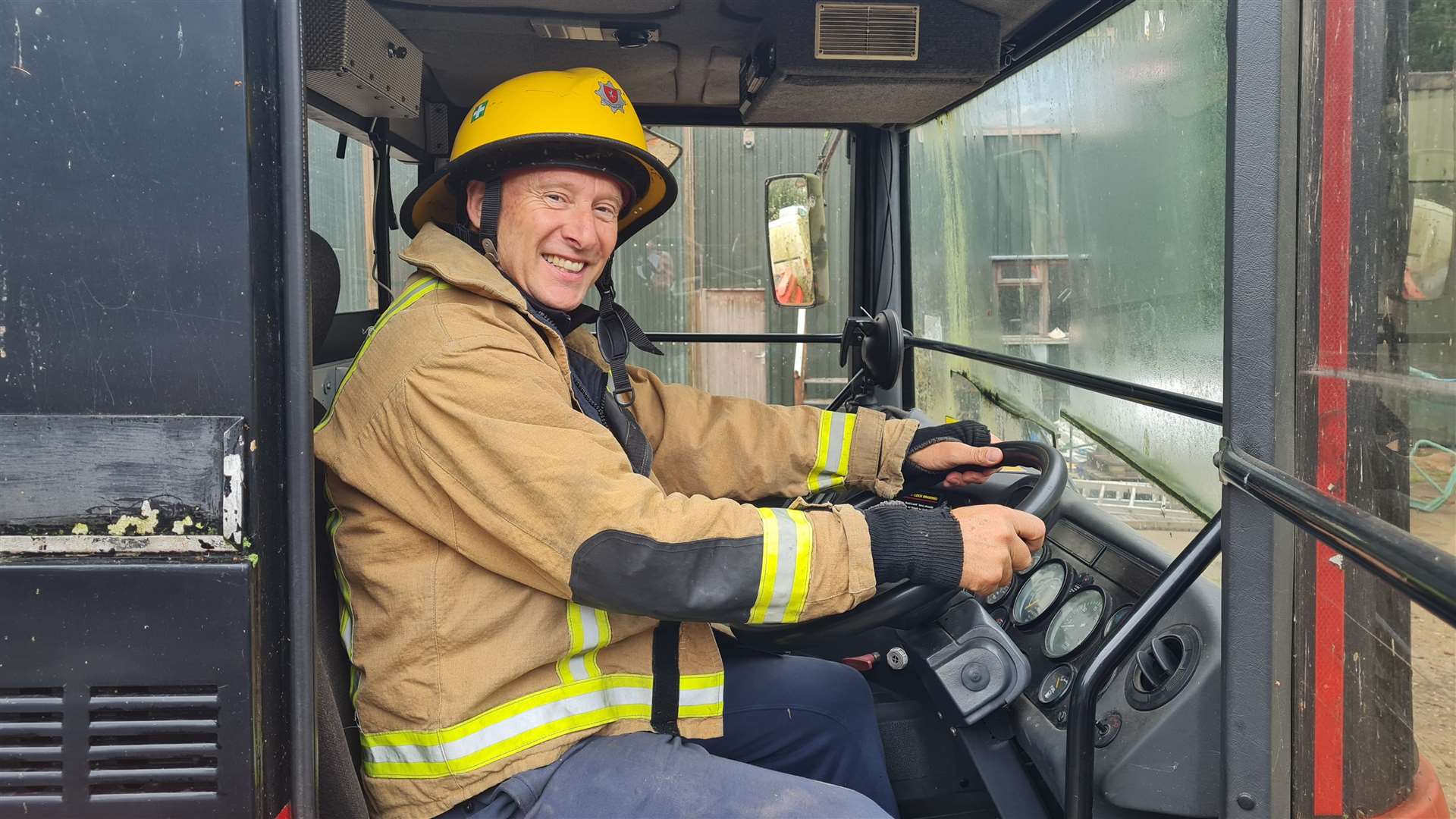 Kris Saxby at the wheel of his fire engine