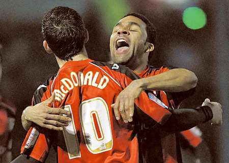 Andy Barcham congratulates Cody McDonald on scoring Gillingham's opening goal against Southend