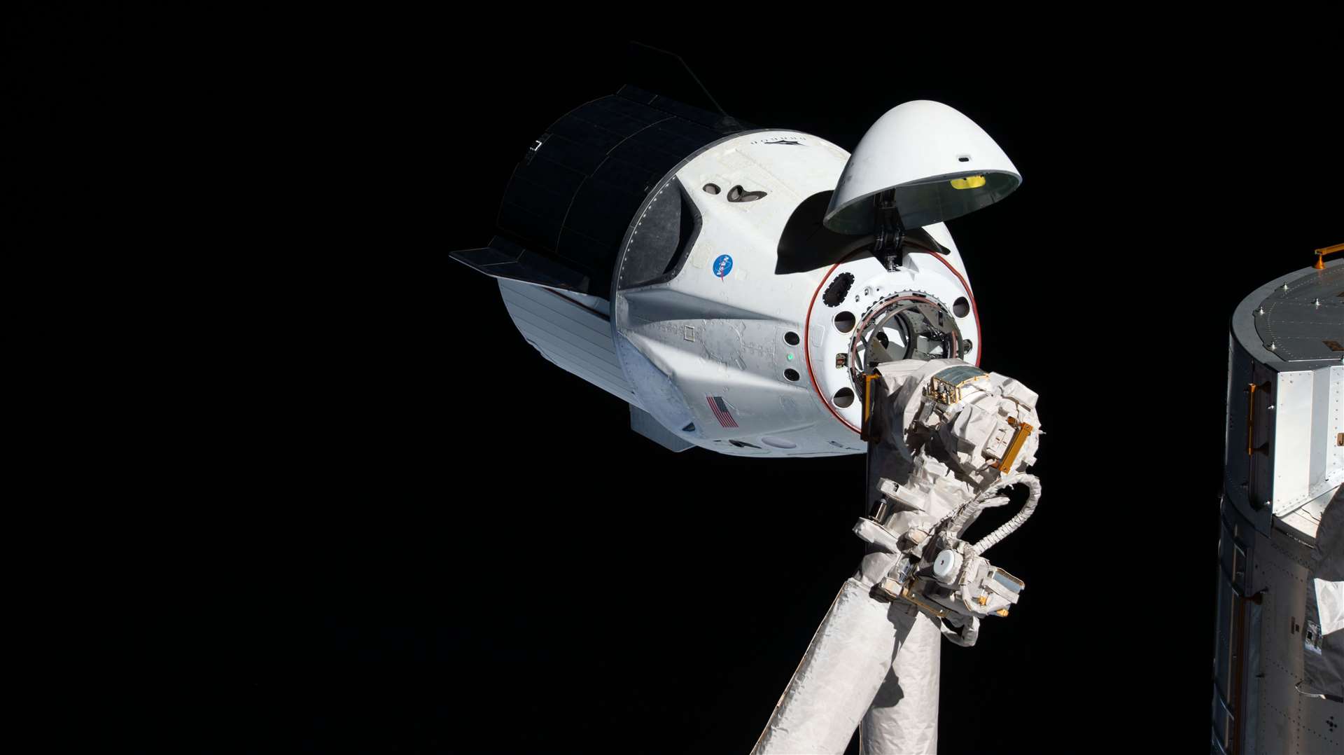 Crew Dragon capsule, just moments before docking with the space station (Nasa)