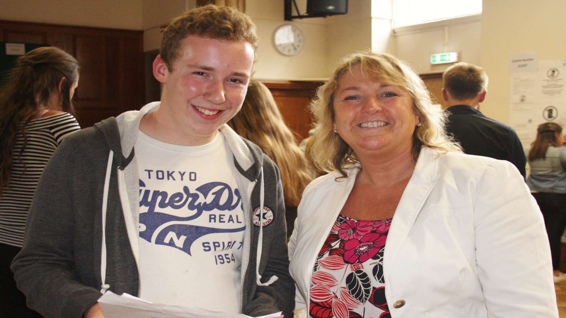 Troy Fordham discusses his GCSE results with retiring assistant head teacher Anne Donnelly at Ursuline College