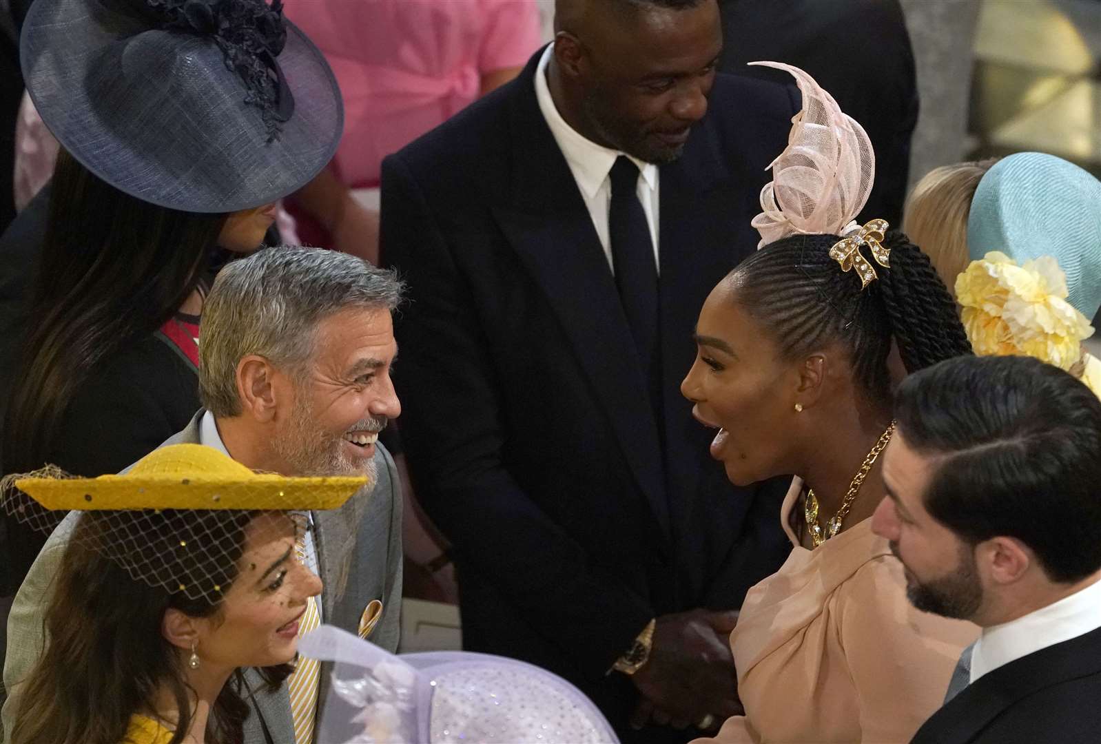 George Clooney greets Serena Williams in St George’s Chapel (Owen Humphreys/PA)