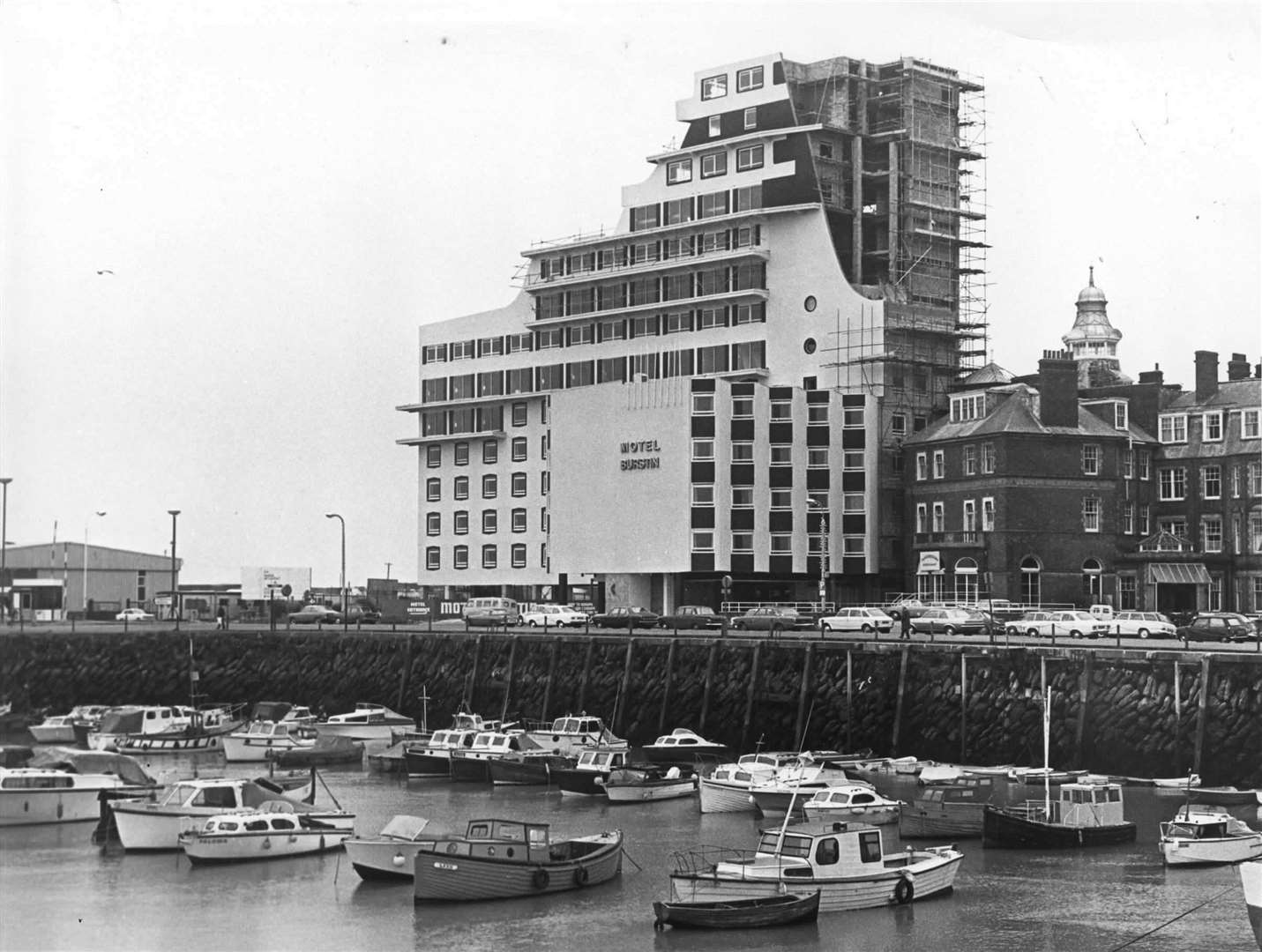 Folkestone harbour with the partly-constructed Hotel Burstin in the background in December 1974