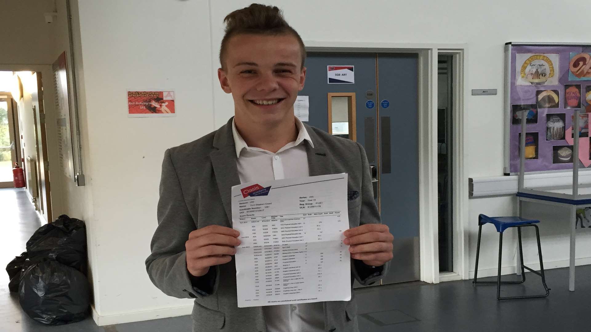 Tom Creed, 18, with his A-level and BTEC results