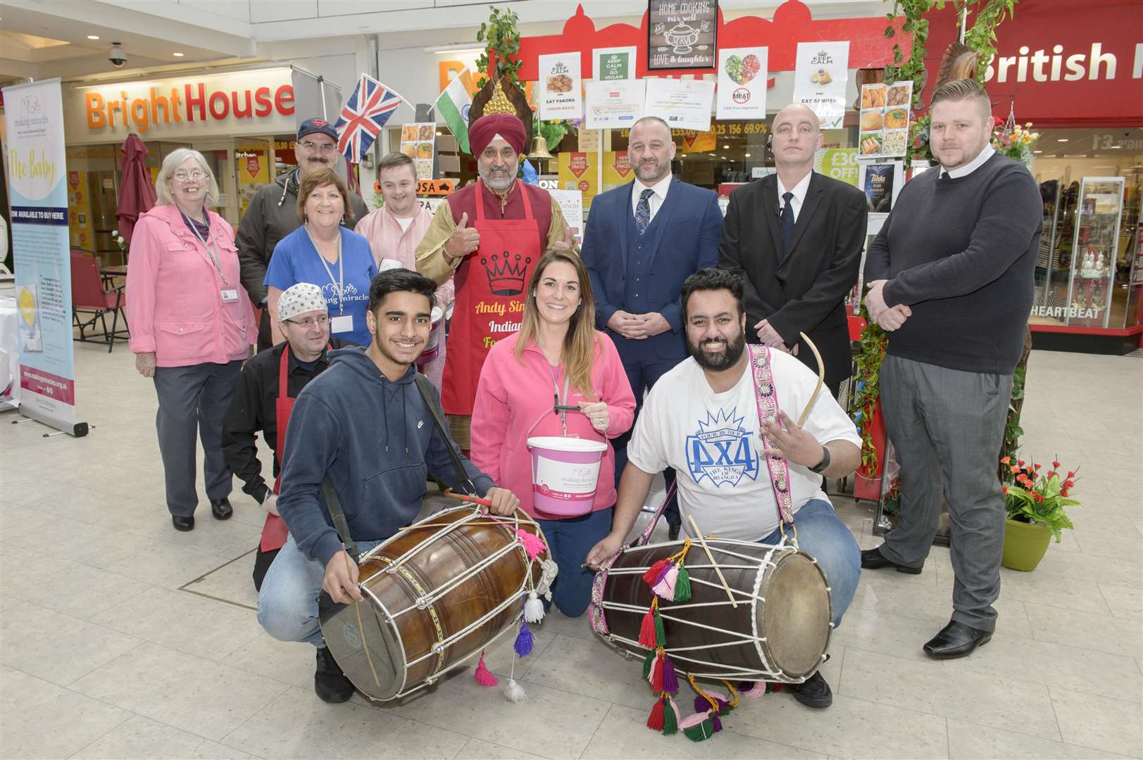 At front, drumming up support, from 4 x 4 are Bhangra drummers Surajsanger Sihota and Dhannjit Sihota. Indian street food seller and character Andy Singh holds a fundraiser for charity Making Miracles, at his stall in the Thamesgate Shopping Centre, Gravesend. Picture: Andy Payton (1415306)