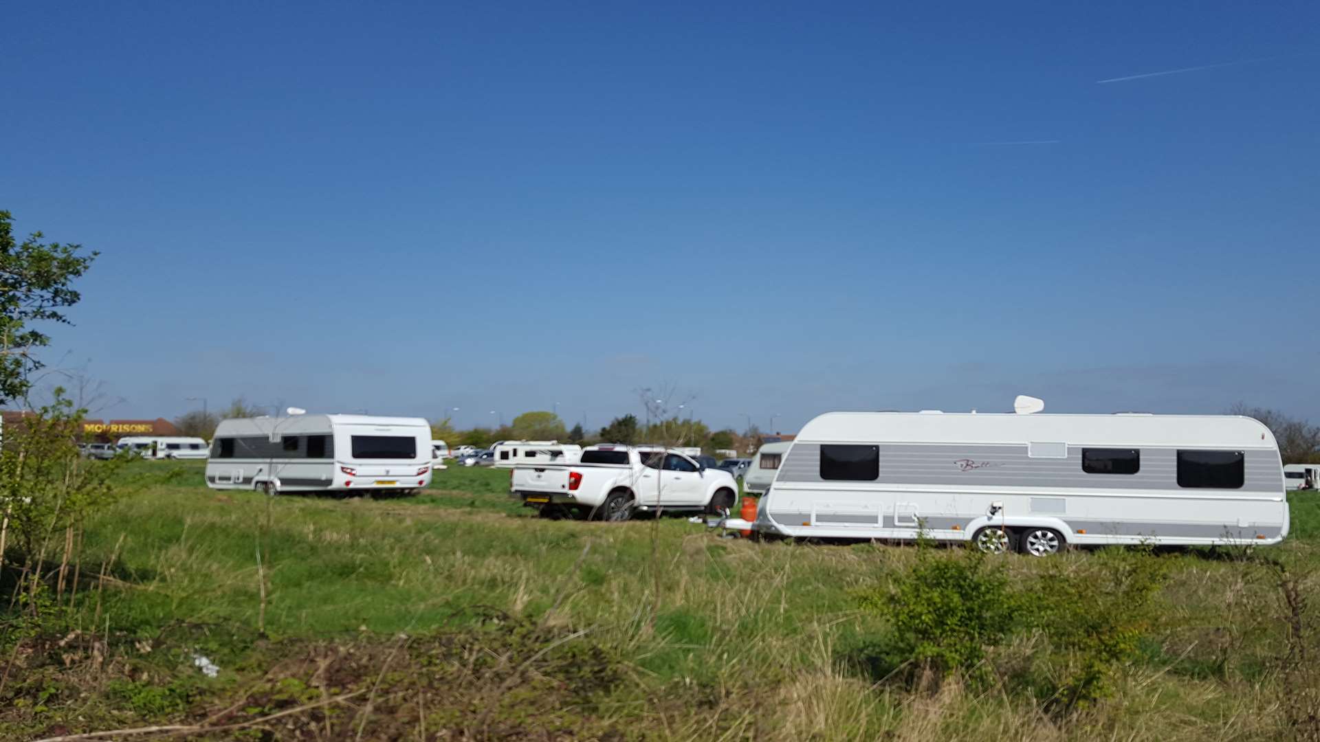 About 20 caravans and numerous other vehicles have appeared in the field