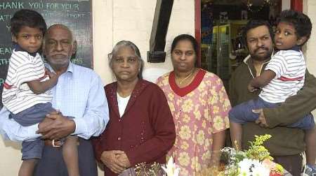 Donald and Mercy Thilagarajan with children William and Edward and Mrs Mercy Thilagarajan's parents William and Rosaline Selvarajah oustide their shop at Woodchurch