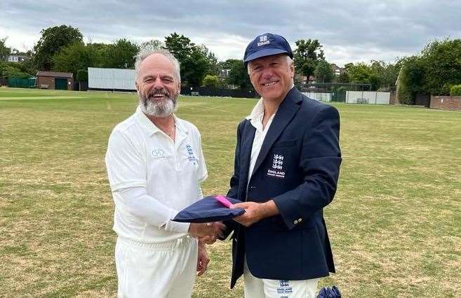 Whitstable's John Butterworth is presented with his England seniors' cap by captain Richard Merriman before their game against Scotland in July