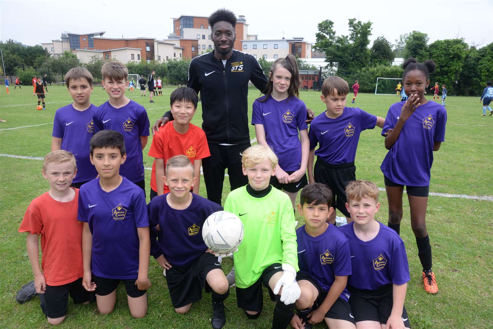 Blair Turgott with the Archbishop Courtenay team at the Aquila Cup youth football tournament held at the Archbishop Courtenay Primary School last summer Picture: Chris Davey