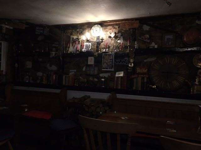 This photo is a little dark, due to the brightness of the light, but believe me this wall, like many of the others, is jam packed with a multitude of knick-knacks