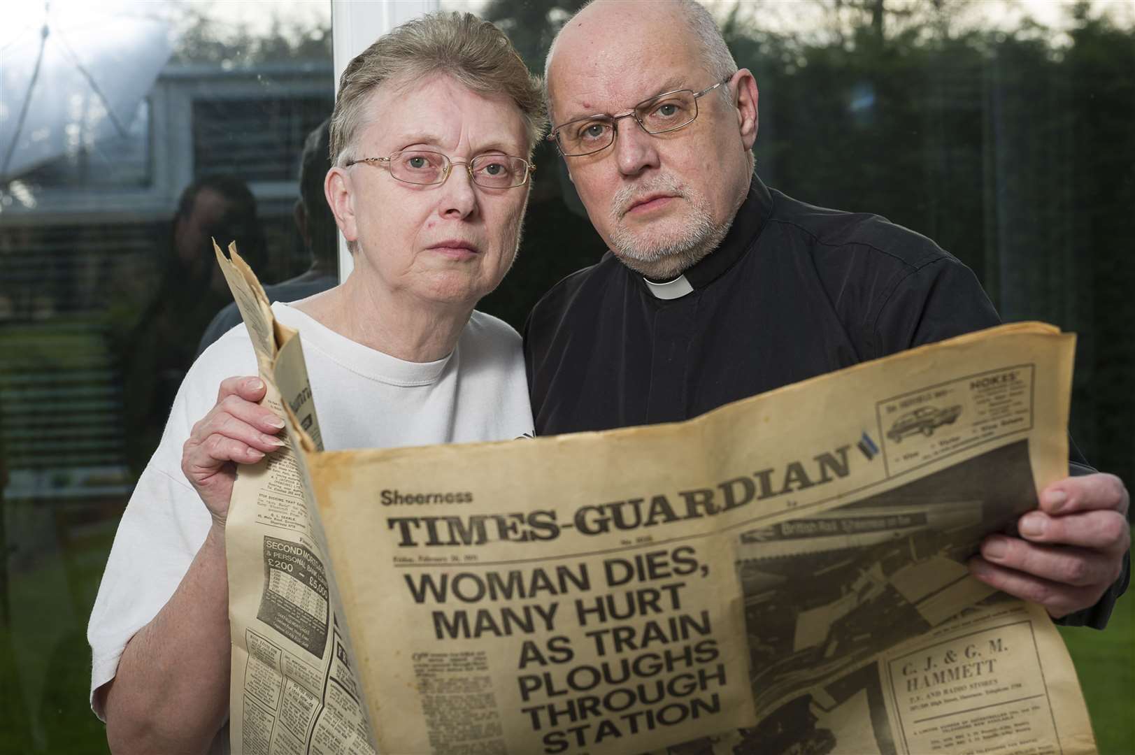 Colin and Lynne Johnson with the copy of the Sheerness Times Guardian from 1971. The couple from Minster Road, Minster, were married and reporters on rival newspapers at the time of the train rail crash. Picture: Andy Payton