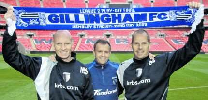 Mark Robson with Gillingham boss Mark Stimson, left, and assistant boss Scott Barrett, right