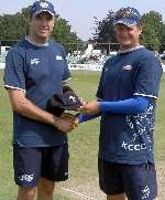 Justin Kemp (left) is presented with his county cap by skipper Rob Key