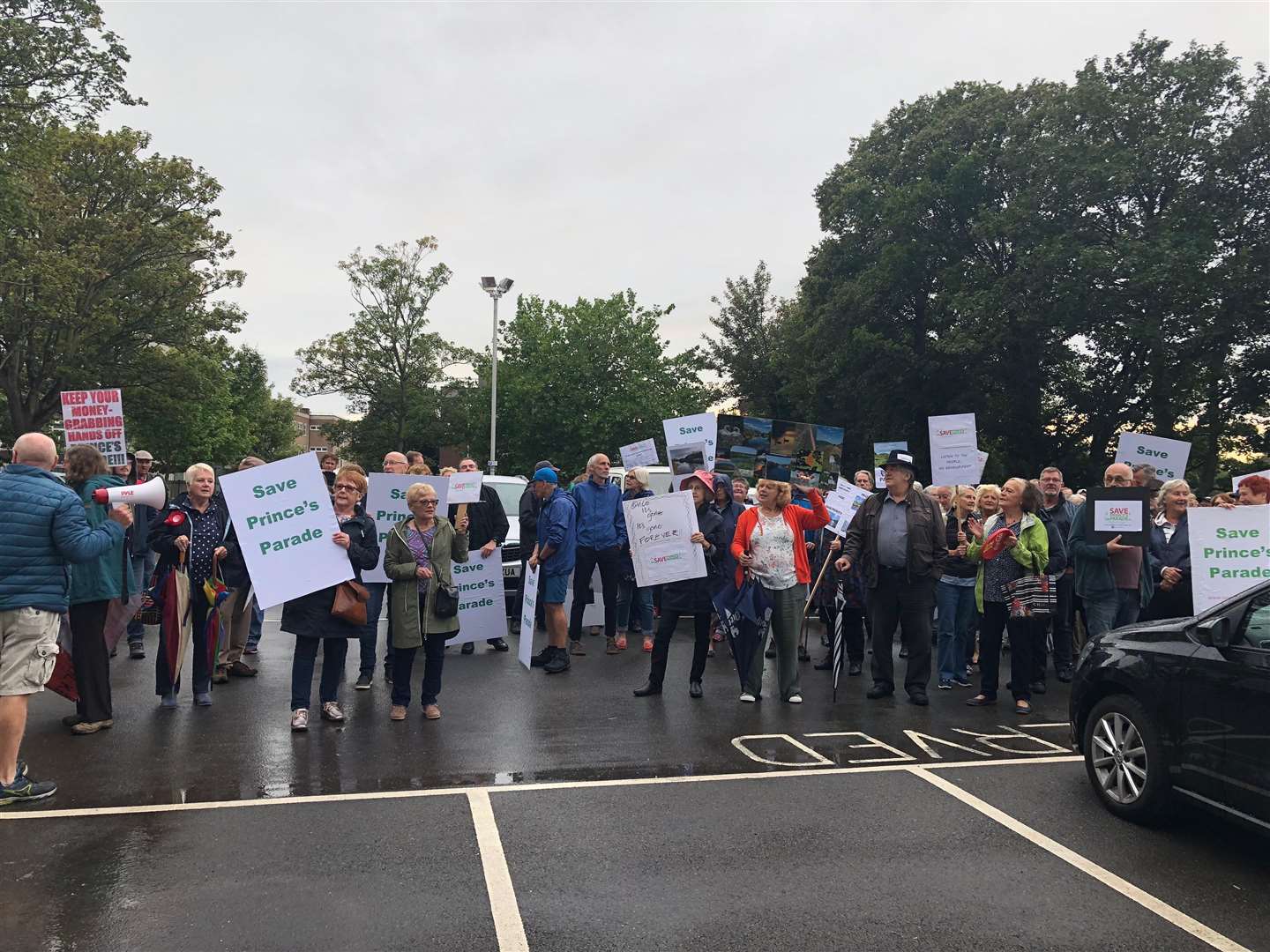 Hundreds of protesters gather outside the council offices
