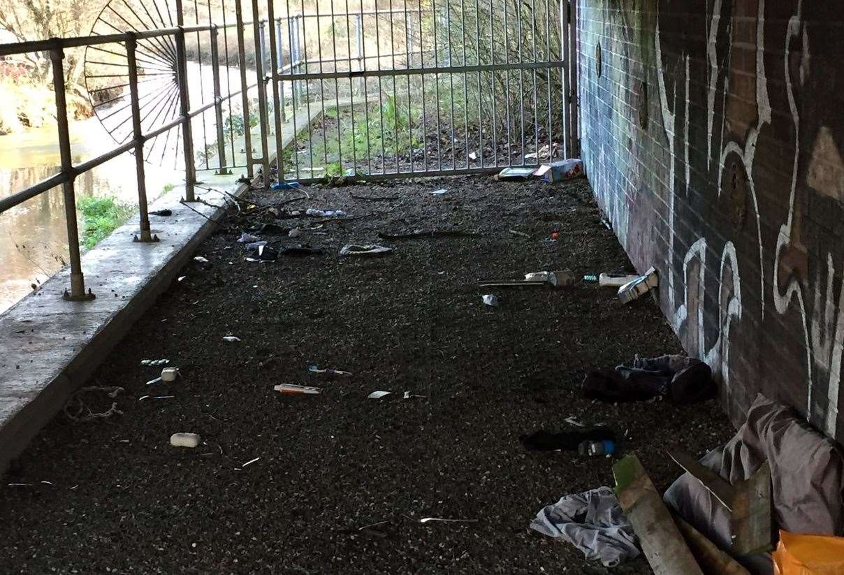 Rubbish and drug paraphernalia left under the bridge in Kingsbrook Park