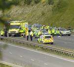 Emergency services at the scene of the crash on the A249, where PC Phillip Pratt was struck and killed by a car. Picture: Barry Crayford