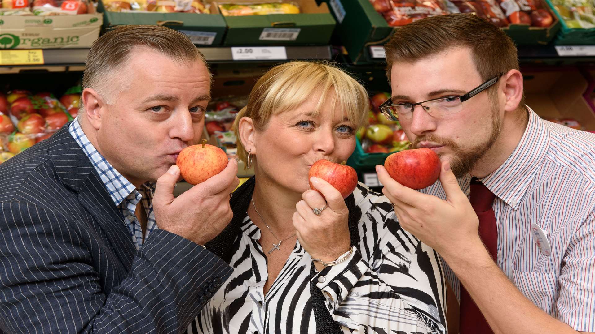 Winner of the Name the Apple Competition, Jacqui Lalley (centre), with Michael Joyles from Avalon Produce (left) and John Worth, Tesco Apple buyer (right).
