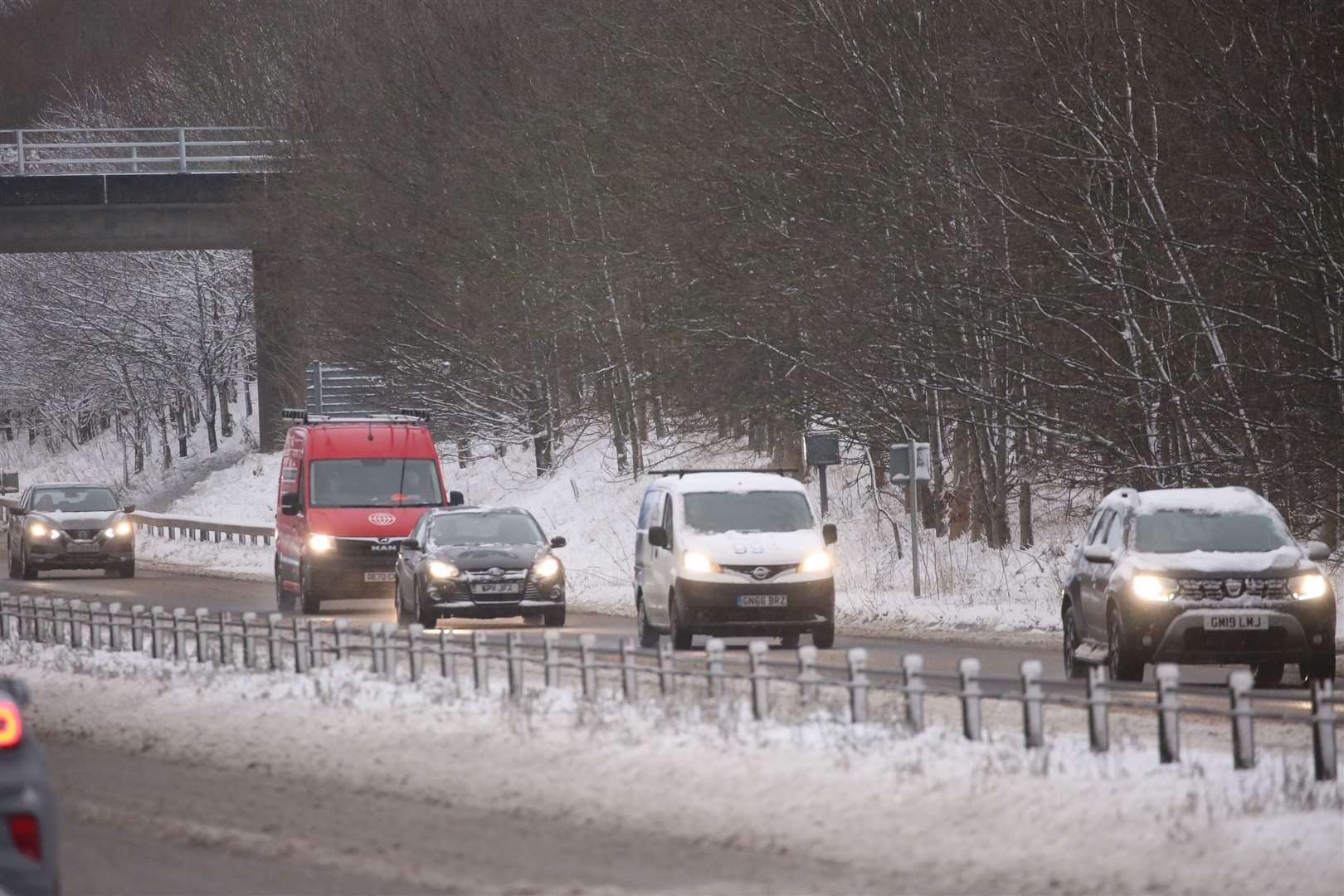 People driving in the snow. Credit: UKNiP